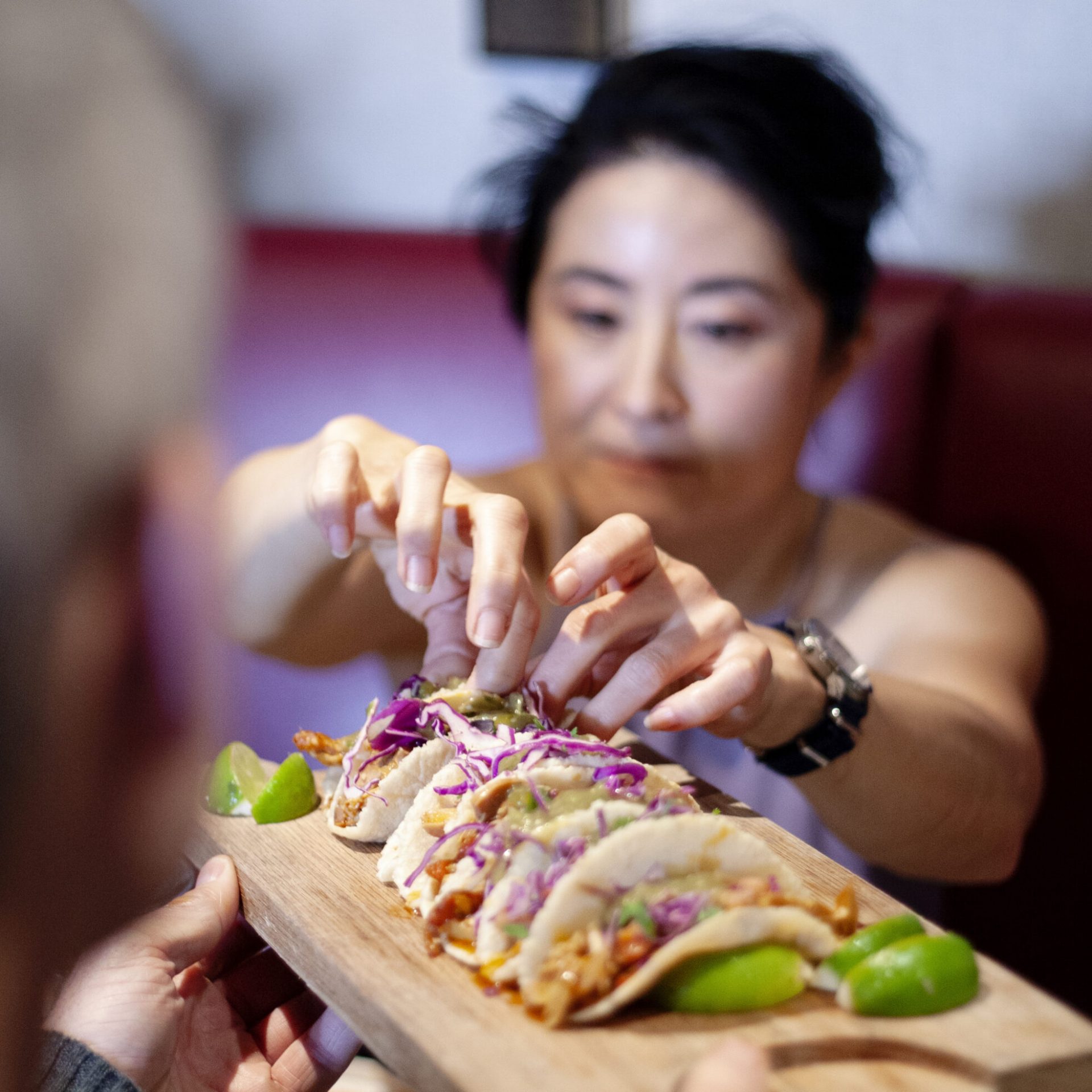 a close up of a person holding a sandwich